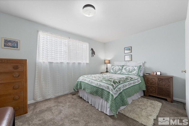 carpeted bedroom with baseboards