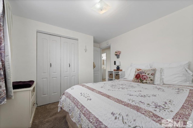 carpeted bedroom featuring a closet