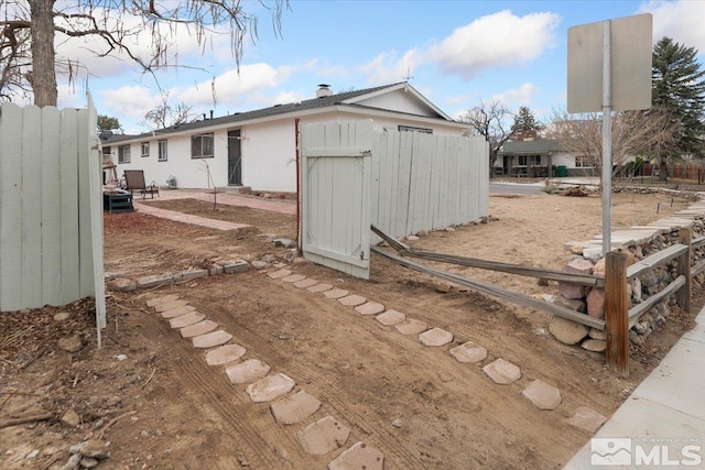 view of outdoor structure featuring fence