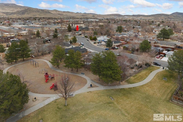 drone / aerial view featuring a residential view and a mountain view