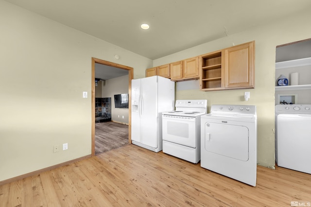 clothes washing area featuring light wood-style floors, baseboards, laundry area, and independent washer and dryer