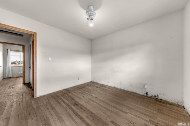 spare room featuring ceiling fan and wood finished floors