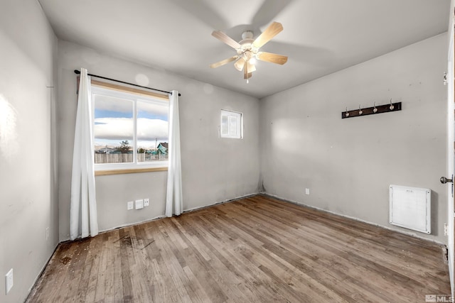 unfurnished room featuring ceiling fan and wood finished floors