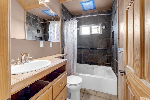 bathroom with toilet, tile patterned flooring, shower / bath combo with shower curtain, and vanity