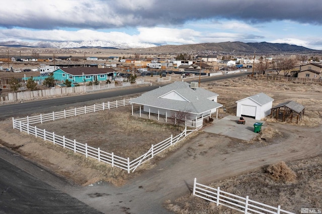 birds eye view of property featuring a mountain view