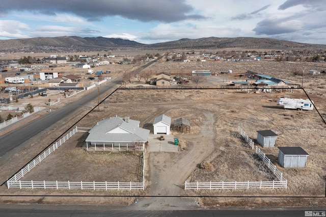 birds eye view of property featuring a rural view and a mountain view