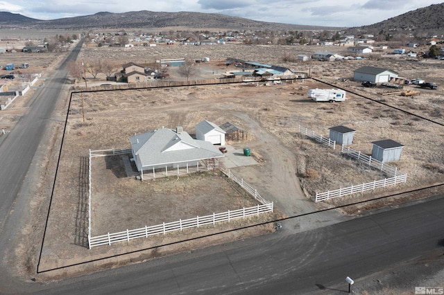 aerial view featuring a rural view and a mountain view