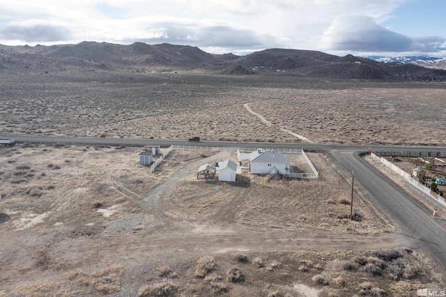 birds eye view of property featuring a mountain view