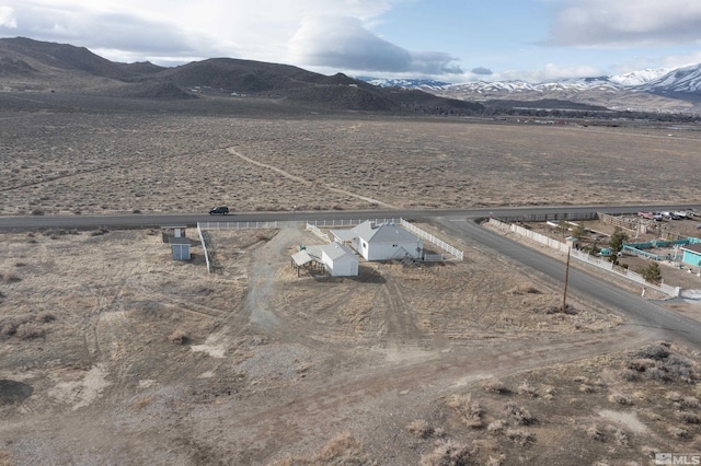 birds eye view of property with a rural view and a mountain view