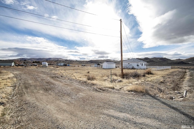 exterior space with a mountain view and a rural view