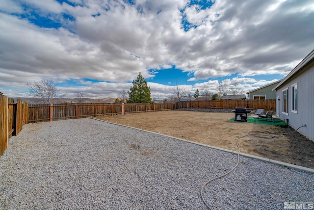 view of yard with a patio area and a fenced backyard