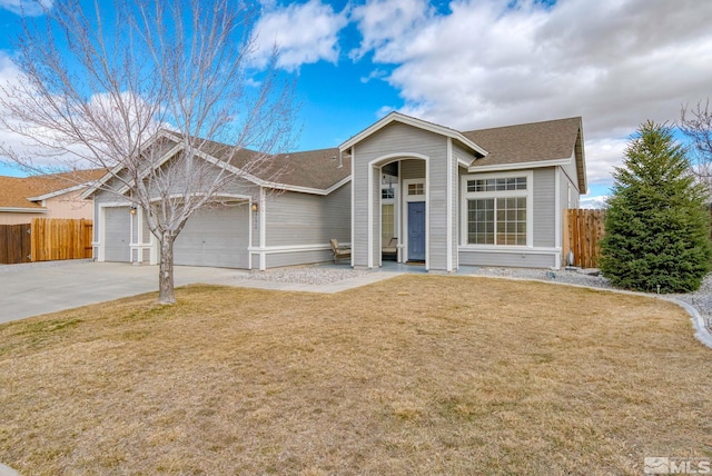 ranch-style home with a garage, driveway, a shingled roof, fence, and a front yard