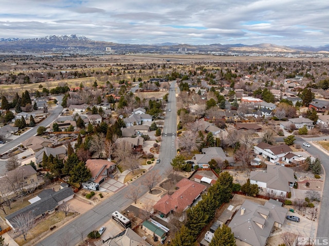 drone / aerial view featuring a residential view and a mountain view