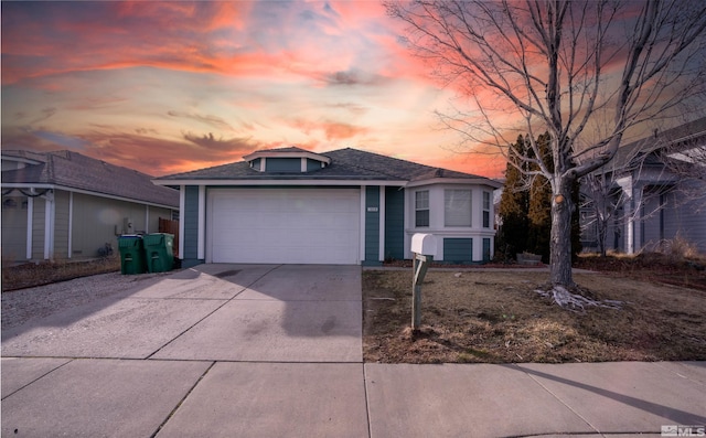 single story home with a garage, concrete driveway, and a shingled roof