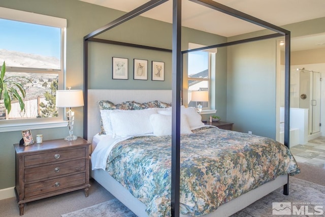 carpeted bedroom featuring connected bathroom