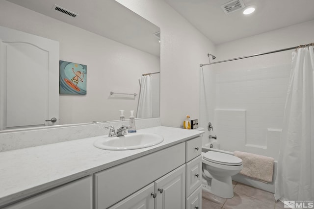 bathroom featuring tile patterned flooring, visible vents, vanity, and toilet