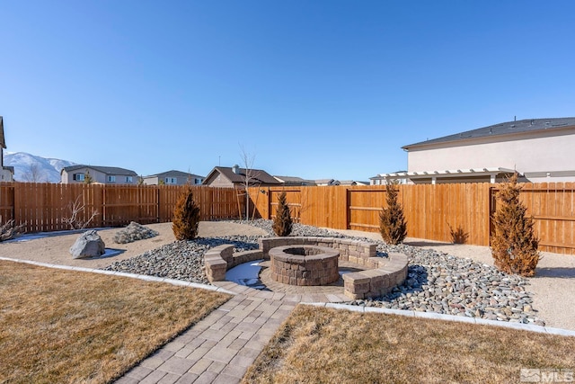 view of yard with an outdoor fire pit and a fenced backyard