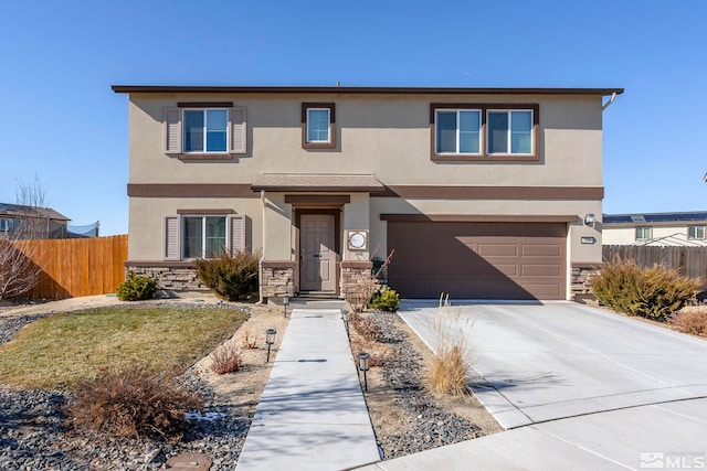 traditional-style house featuring stone siding, fence, driveway, and stucco siding