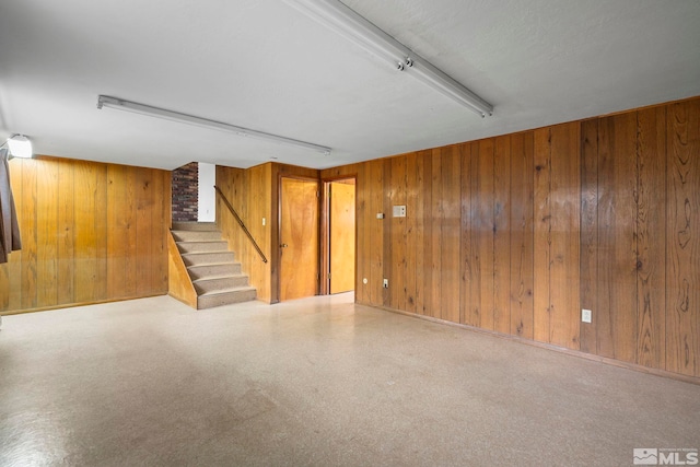 interior space with wooden walls and stairs