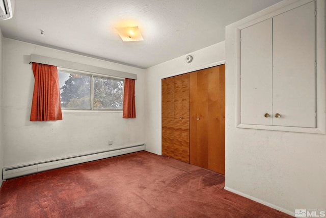 unfurnished bedroom featuring carpet floors, a baseboard radiator, and a closet