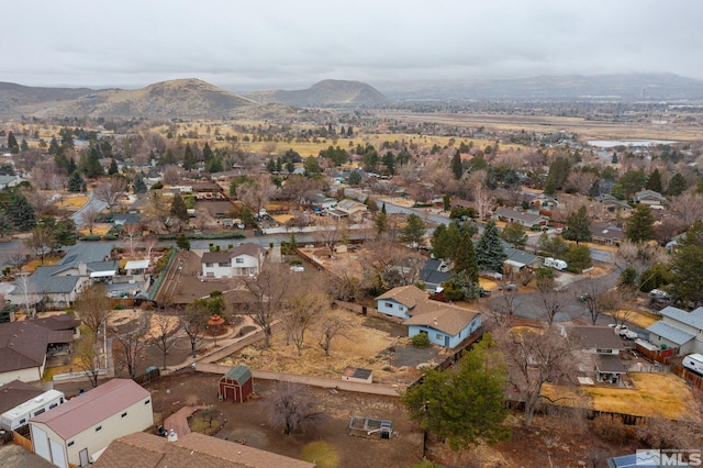 drone / aerial view featuring a residential view and a mountain view