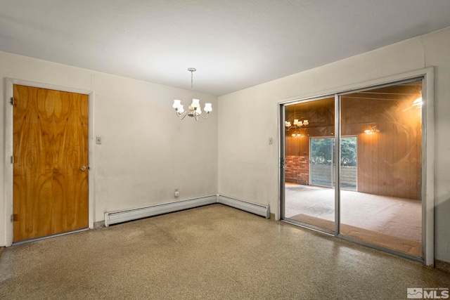 unfurnished room with an inviting chandelier and a baseboard heating unit