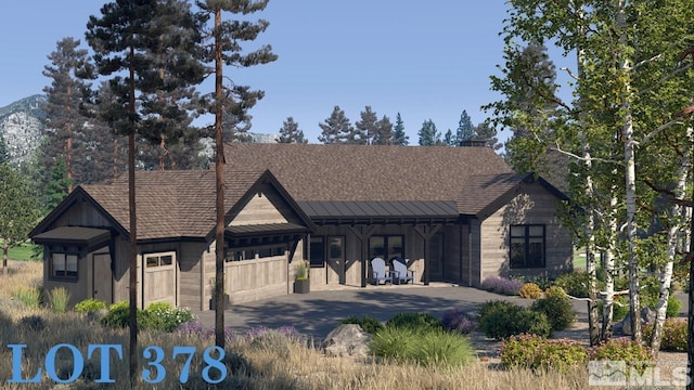 view of front of property featuring a garage and concrete driveway