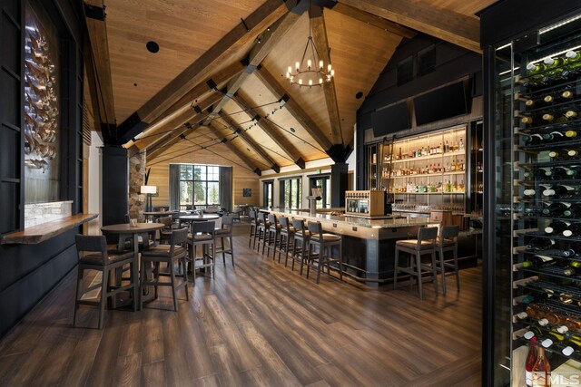 wine area with an inviting chandelier, wood ceiling, wood finished floors, high vaulted ceiling, and beamed ceiling