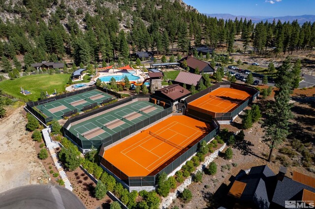 birds eye view of property with a wooded view