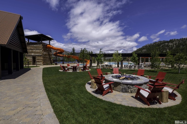 view of yard featuring an outdoor fire pit