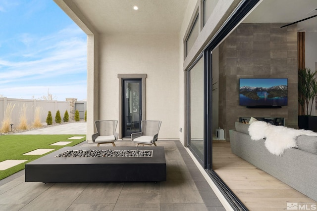 view of patio with fence and an outdoor hangout area