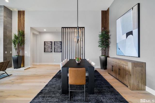 dining room featuring recessed lighting, light wood-style flooring, and baseboards