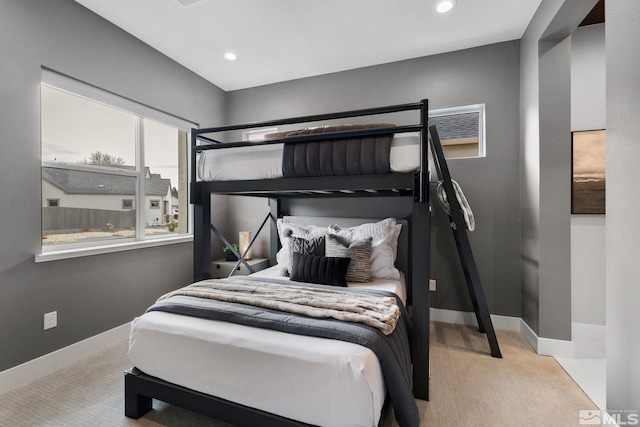 bedroom featuring recessed lighting, carpet flooring, and baseboards