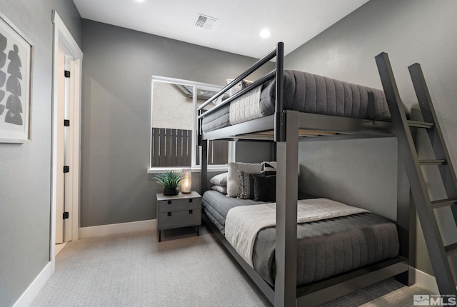 carpeted bedroom featuring recessed lighting, visible vents, and baseboards