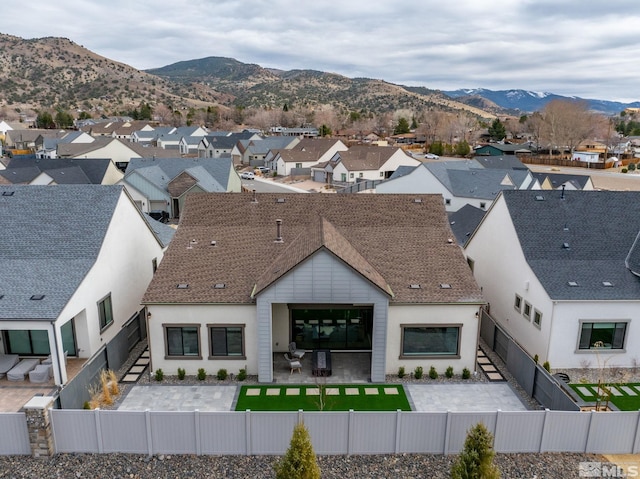 drone / aerial view featuring a mountain view and a residential view