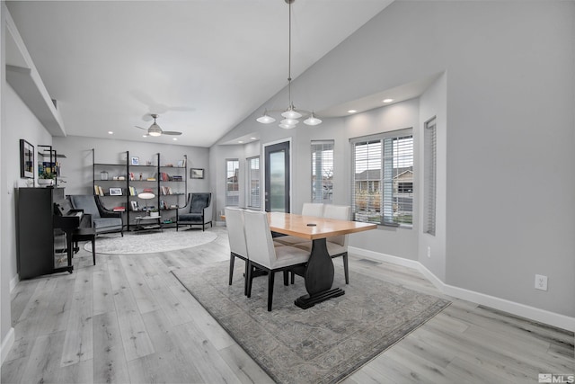 dining space with baseboards, ceiling fan, visible vents, and light wood-style floors