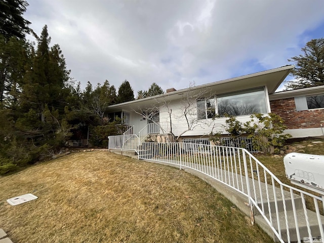 view of front of home with a front lawn