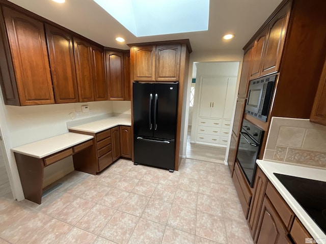 kitchen with black appliances, decorative backsplash, light countertops, and recessed lighting