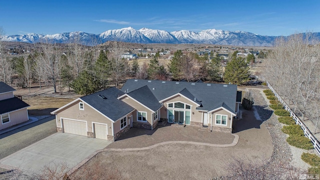 birds eye view of property with a mountain view