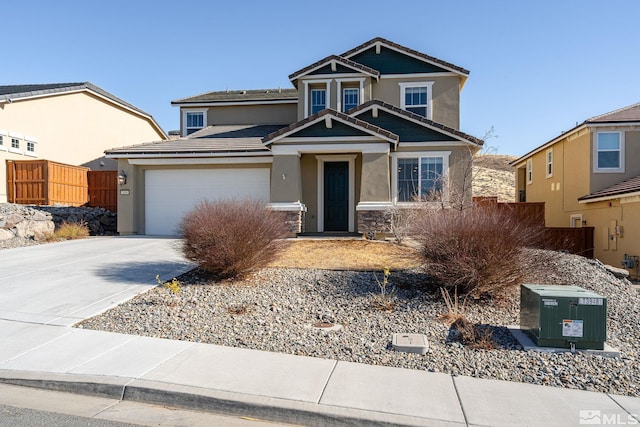 craftsman house with a tile roof, stucco siding, fence, a garage, and driveway