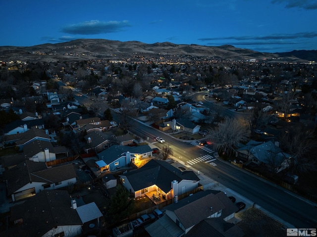 drone / aerial view with a residential view and a mountain view