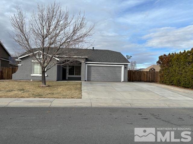 ranch-style house with concrete driveway, an attached garage, fence, and stucco siding