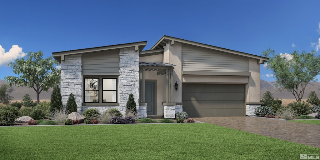 modern home with decorative driveway, stone siding, a front lawn, and a garage