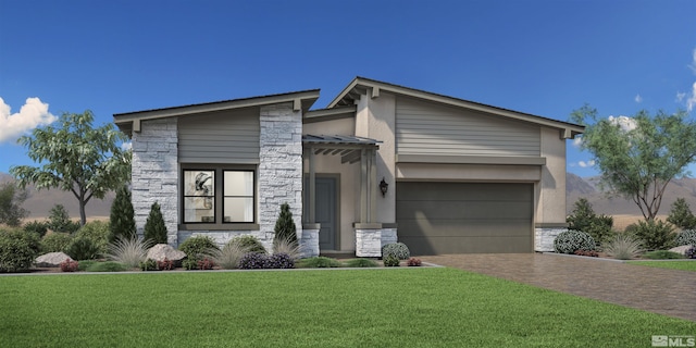 modern home with decorative driveway, stone siding, a front lawn, and a garage