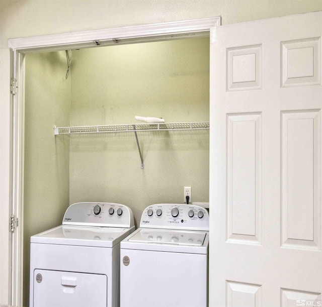 clothes washing area with laundry area and separate washer and dryer