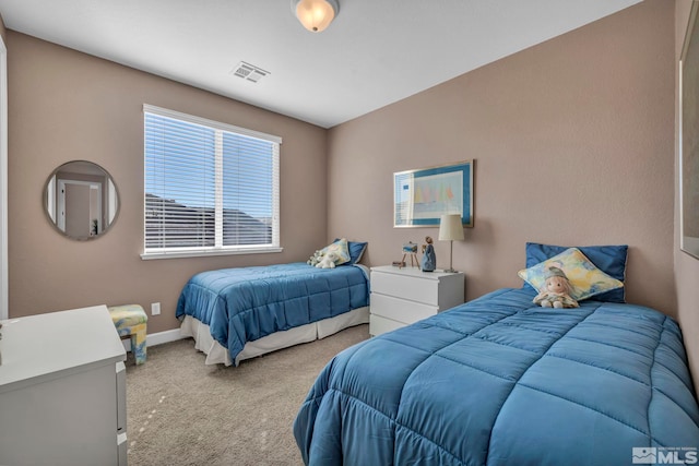 bedroom with carpet flooring, visible vents, and baseboards