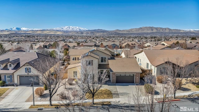 bird's eye view with a residential view and a mountain view