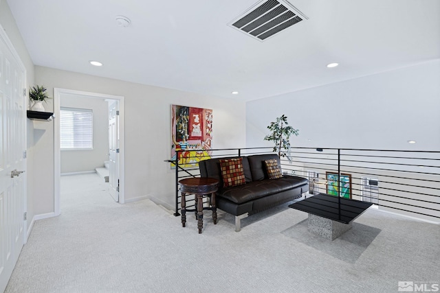 sitting room with baseboards, carpet flooring, visible vents, and recessed lighting