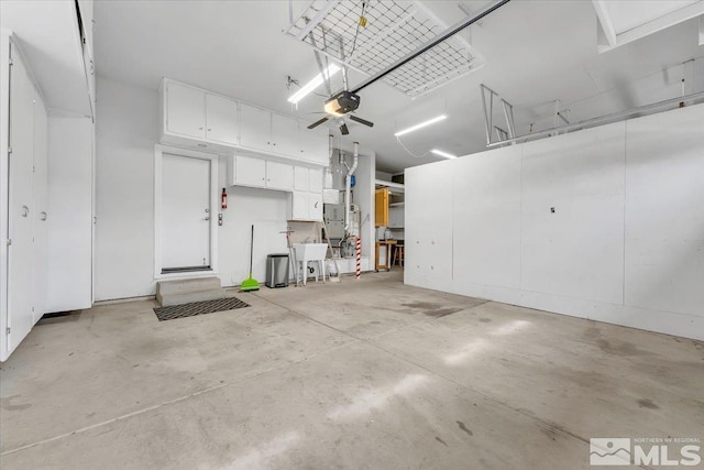 garage with a garage door opener and a sink