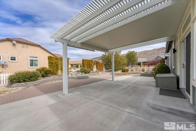 view of patio featuring a mountain view and a pergola